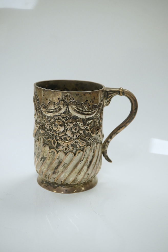 A late Victorian demi- wrythened fluted and embossed christening mug, by Josiah Williams & Co, London, 1892, 94mm, 4.6oz. Condition - poor to fair